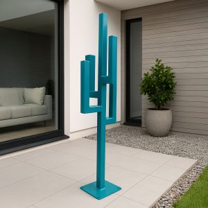 Strata sculpture resembling a geometric cactus in teal steel, displayed on a modern patio.